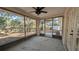Screened porch with ceiling fan and view of backyard at 3639 Bream Cir, Fruitland Park, FL 34731