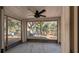 Bright screened porch overlooking backyard with ceiling fan at 3639 Bream Cir, Fruitland Park, FL 34731