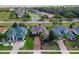 An aerial shot of the house and surrounding neighborhood at 38626 Lakeview Walk, Lady Lake, FL 32159