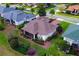 Aerial view showcasing the home's backyard and landscaping at 38626 Lakeview Walk, Lady Lake, FL 32159