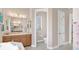 Elegant bathroom with double sinks, a soaking tub, and a separate shower at 38626 Lakeview Walk, Lady Lake, FL 32159
