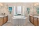Bathroom with soaking tub, double vanity, and walk-in shower at 38626 Lakeview Walk, Lady Lake, FL 32159