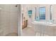 Spa-like bathroom with soaking tub and walk-in shower at 38626 Lakeview Walk, Lady Lake, FL 32159