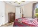 Bedroom with a built-in dresser and access to the kitchen at 38626 Lakeview Walk, Lady Lake, FL 32159