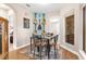 Small breakfast nook with glass table and guitar decor at 38626 Lakeview Walk, Lady Lake, FL 32159