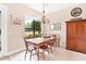 Charming dining room with wooden table and chairs at 38626 Lakeview Walk, Lady Lake, FL 32159