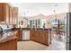 Kitchen with granite countertops and wooden cabinetry at 38626 Lakeview Walk, Lady Lake, FL 32159
