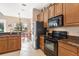 Modern kitchen with stainless steel appliances at 38626 Lakeview Walk, Lady Lake, FL 32159