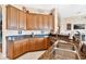 Kitchen with granite countertops and wooden cabinets at 38626 Lakeview Walk, Lady Lake, FL 32159