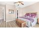 Main bedroom with king-size bed and walk-in closet at 38626 Lakeview Walk, Lady Lake, FL 32159