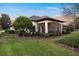 Spacious screened porch with comfy seating and sunset views at 38626 Lakeview Walk, Lady Lake, FL 32159