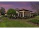 Spacious screened porch with seating area and backyard view at 38626 Lakeview Walk, Lady Lake, FL 32159