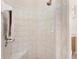 Walk-in shower with tiled walls and built-in seat at 38626 Lakeview Walk, Lady Lake, FL 32159