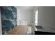 Modern bathroom with blue marble walls, a sleek vanity, and contemporary fixtures at 39817 Forest Dr, Eustis, FL 32736