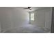 Bedroom featuring natural light from the window and a door in the right of the photo at 39817 Forest Dr, Eustis, FL 32736