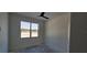 White bedroom with a window overlooking the outside, allowing for natural light at 39817 Forest Dr, Eustis, FL 32736