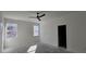 Bedroom featuring natural light from the windows and a modern ceiling fan at 39817 Forest Dr, Eustis, FL 32736