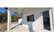 Home exterior featuring a covered patio with white columns and a view of the surrounding landscape at 39817 Forest Dr, Eustis, FL 32736