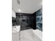 Stunning bathroom showcases a glass-enclosed shower, double vanity with marble counters, and modern finishes at 42157 Tamarac St, Eustis, FL 32736