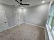 Bedroom with carpet, neutral walls, a ceiling fan, and windows with natural light at 42157 Tamarac St, Eustis, FL 32736