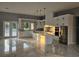 Spacious kitchen with a large island, white cabinetry, and stainless steel refrigerator at 42157 Tamarac St, Eustis, FL 32736