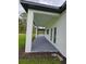 Long covered outdoor patio with backyard access through French doors, offering seamless indoor-outdoor living at 42157 Tamarac St, Eustis, FL 32736