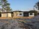 Contemporary home featuring a clean white and dark gray color scheme and a side-entry garage at 42200 Chinaberry St, Eustis, FL 32736