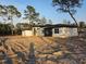 Beautiful modern home with sleek design, large windows, and lush landscaping at 42200 Chinaberry St, Eustis, FL 32736