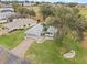 Attractive home on a landscaped lot with paver driveway, located near a golf course at 5004 Saint Andrews Arc, Leesburg, FL 34748