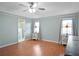 Spacious bedroom with wood floors and access to bathroom at 5004 Saint Andrews Arc, Leesburg, FL 34748
