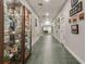 Community hallway showcasing artwork and a pool table at 5004 Saint Andrews Arc, Leesburg, FL 34748