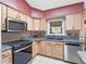 Well-equipped kitchen, featuring stainless steel appliances at 5004 Saint Andrews Arc, Leesburg, FL 34748