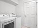 Bright laundry room with washer and dryer hookups at 5004 Saint Andrews Arc, Leesburg, FL 34748