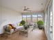 Relaxing sunroom with ample seating and views at 5004 Saint Andrews Arc, Leesburg, FL 34748