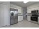 Modern kitchen with stainless steel appliances and white cabinets at 5622 King James Ave, Leesburg, FL 34748