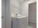Laundry room with washer, dryer, and shelving at 5622 King James Ave, Leesburg, FL 34748
