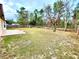 Backyard with patio and surrounding trees at 61 Fir Dr, Ocala, FL 34472