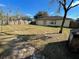 Large backyard with patio and mature trees at 61 Fir Dr, Ocala, FL 34472