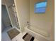 Clean bathroom with bathtub, shower, and tile flooring at 61 Fir Dr, Ocala, FL 34472
