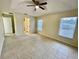 Spacious bedroom with tile floors and ceiling fan at 61 Fir Dr, Ocala, FL 34472