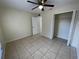 Spacious bedroom with tile flooring and a large closet at 61 Fir Dr, Ocala, FL 34472