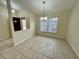 Bright dining area with tile flooring and large window at 61 Fir Dr, Ocala, FL 34472