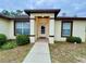 Inviting front entrance with covered porch and walkway at 61 Fir Dr, Ocala, FL 34472