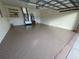 Garage with epoxy flooring and extra storage at 61 Fir Dr, Ocala, FL 34472