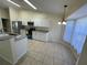 Kitchen with stainless steel appliances and tile floor at 61 Fir Dr, Ocala, FL 34472