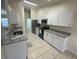 Bright kitchen with granite countertops and stainless steel appliances at 61 Fir Dr, Ocala, FL 34472