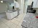 Modern kitchen with white cabinets and granite countertops at 61 Fir Dr, Ocala, FL 34472