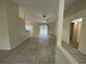 Spacious living room with tile floors and access to backyard at 61 Fir Dr, Ocala, FL 34472