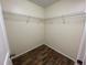 Large walk-in closet with wire shelving and wood flooring at 61 Fir Dr, Ocala, FL 34472