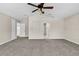 Main bedroom with carpet, ceiling fan and access to en-suite bathroom at 632 Monte Vista Way, Winter Garden, FL 34787